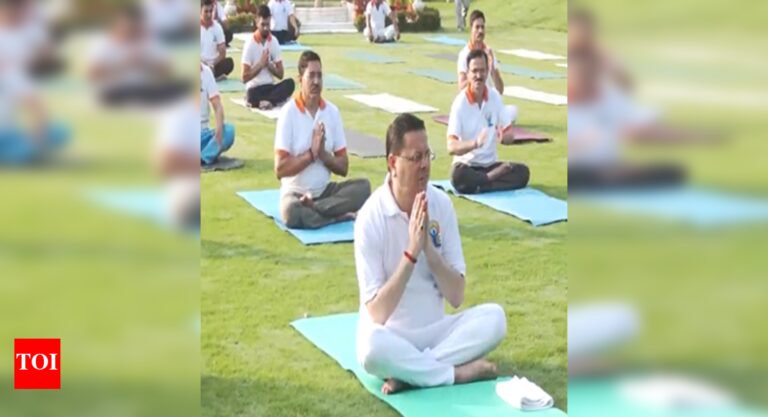 CM Dhami practises yoga ahead of International Yoga Day | India News
